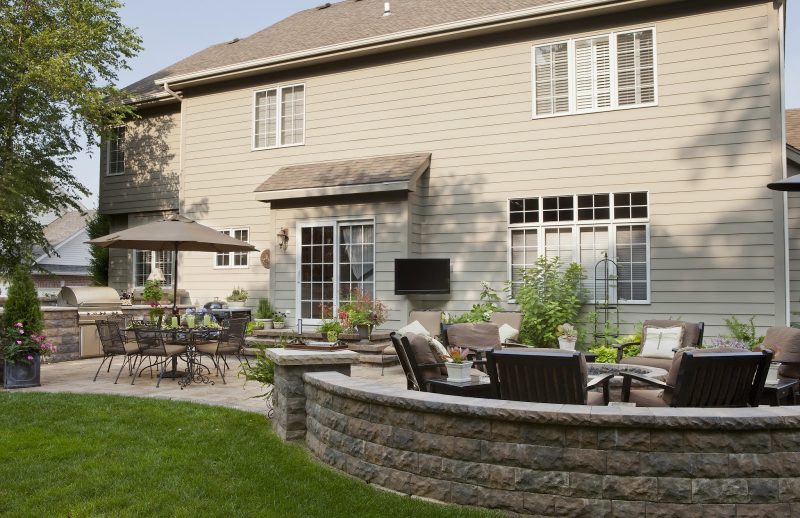 dedicated fire pit area with built-in outdoor kitchen with both a gas grill and charcoal grill and Outdoor TV