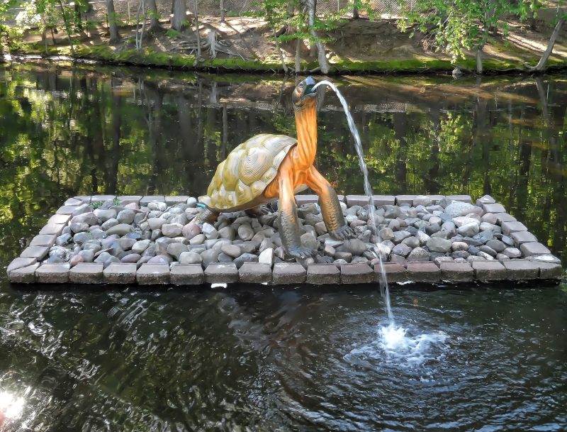 painted brass spouting turtle fountain with river rocks rectangle fountain base and stone base coping and duck pond